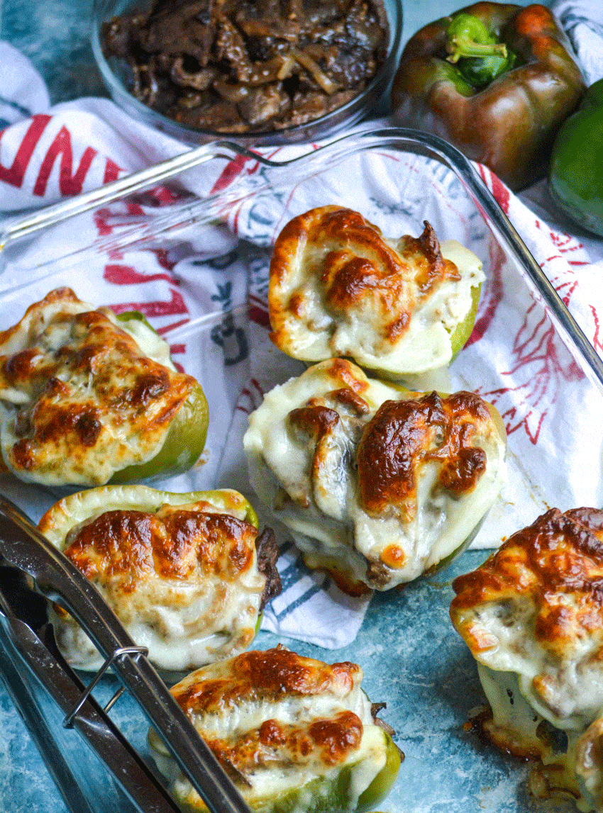 philly cheesesteak stuffed peppers in a glass baking dish