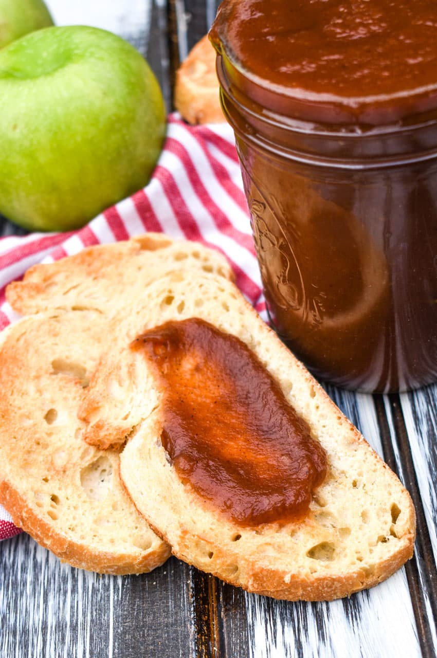 crockpot apple butter spread on a slice of toasted bread