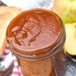 crockpot apple butter in a glass mason jar