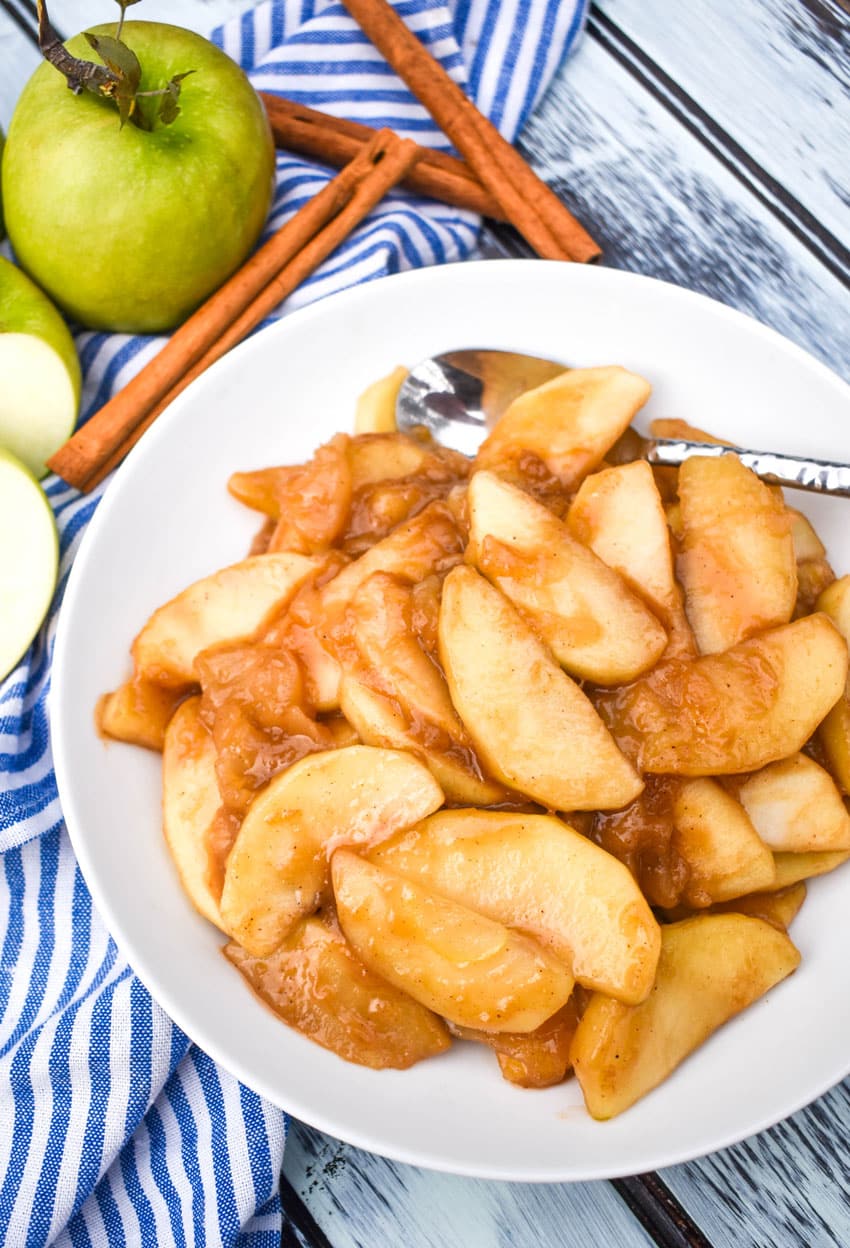 slow cooker cracker barrel fried apples in a shallow white bowl