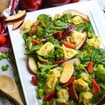 Apple Tortellini Salad With Strawberries on a large white serving platter