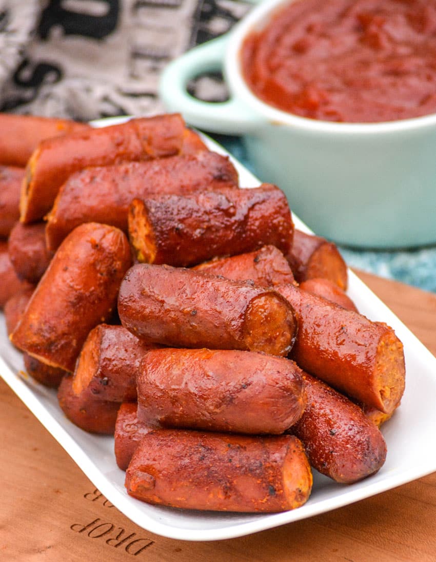 Smoked Hot Dog Burnt Ends smoked hot dog burnt ends piled on a small white serving platter