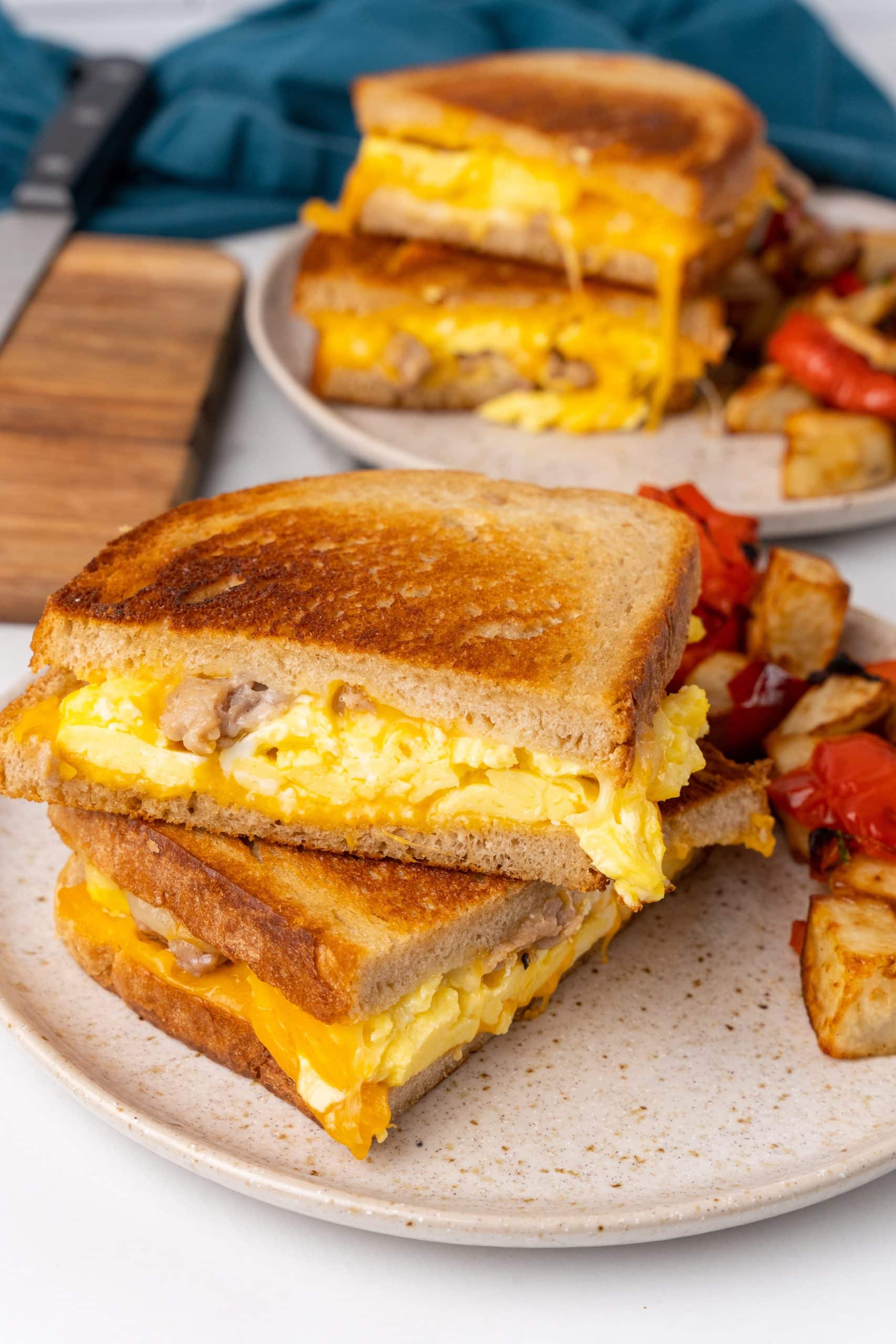 a breakfast grilled cheese sandwich on a white plate