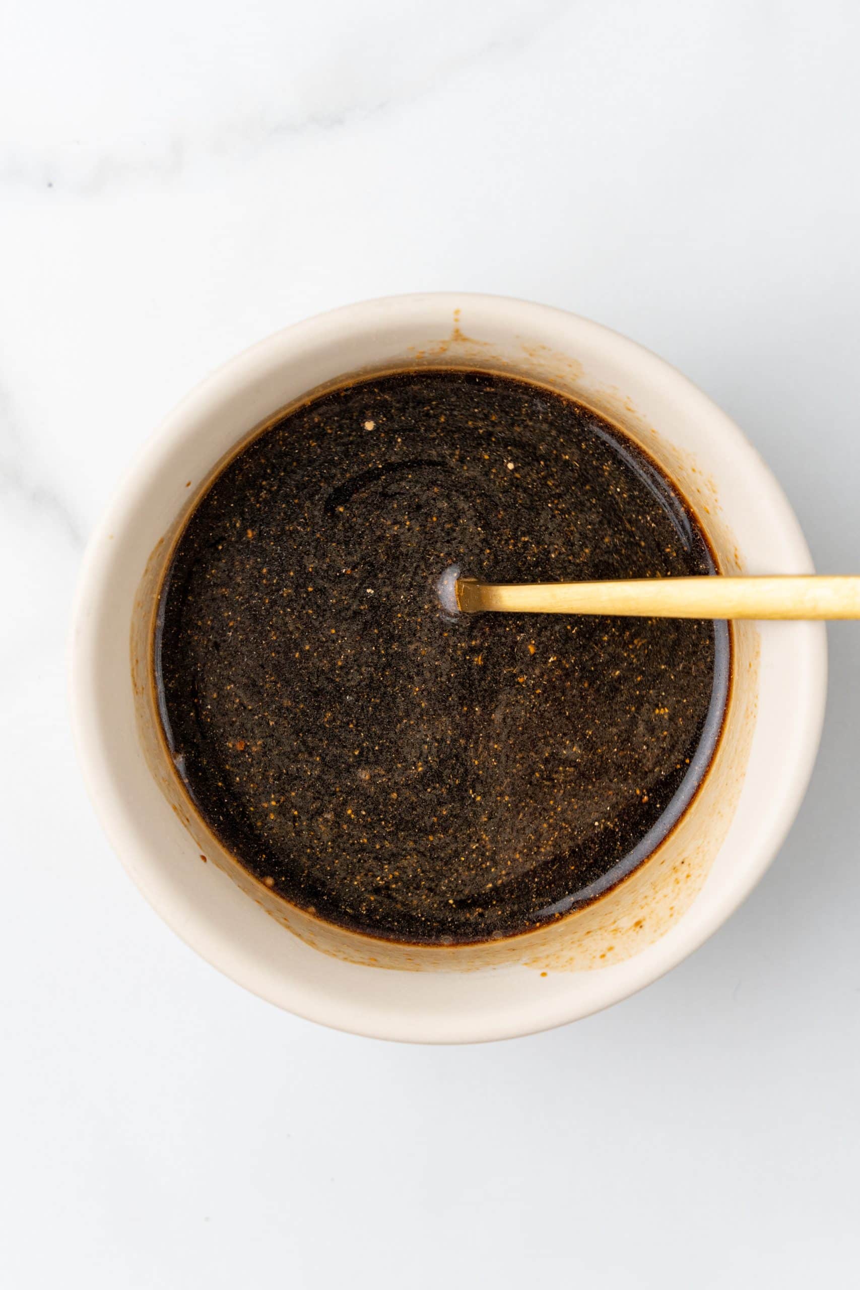 homemade Asian sauce mixture in a white prep bowl