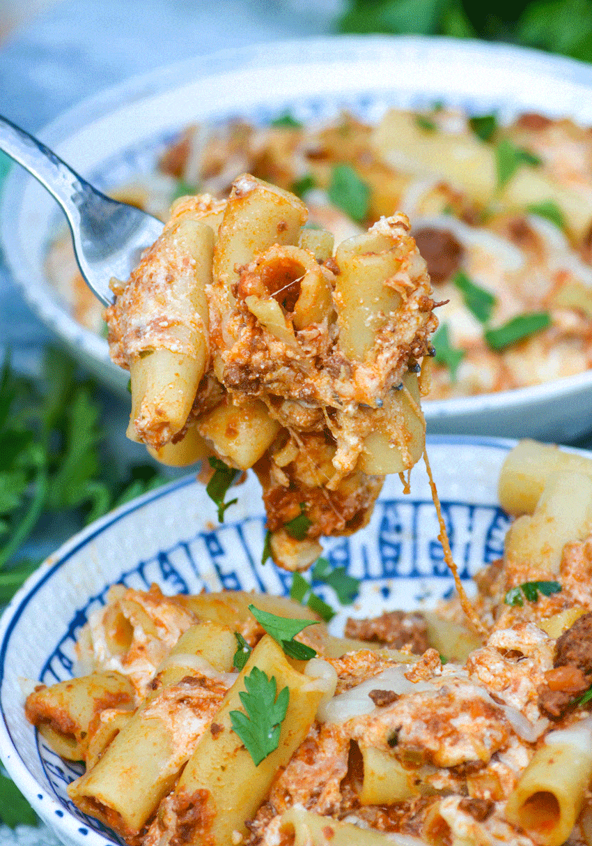 a silver fork holding up a scoop of easy baked ziti casserole