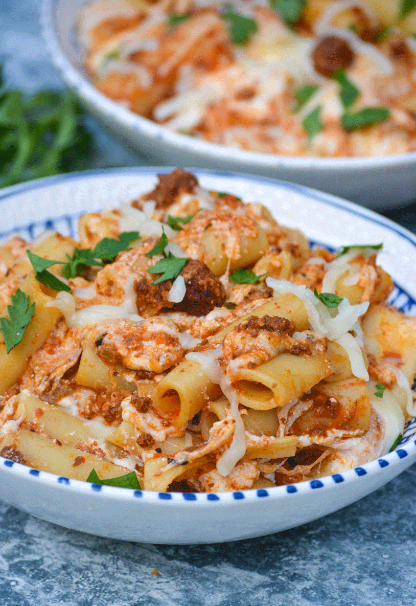 Easy Baked Ziti Recipe easy baked ziti recipe in two bowls with slices of crusty bread on the side
