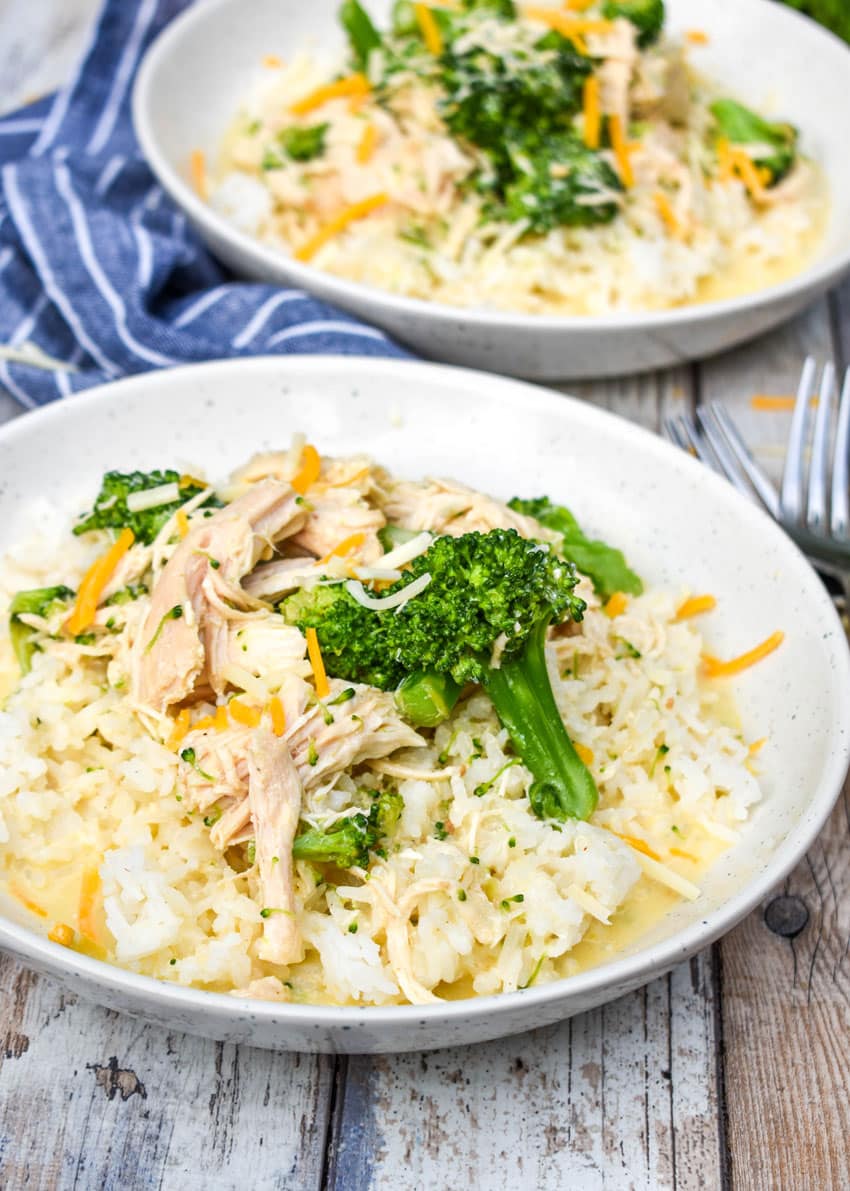 slow cooker chicken and broccoli over rice in a white bowl