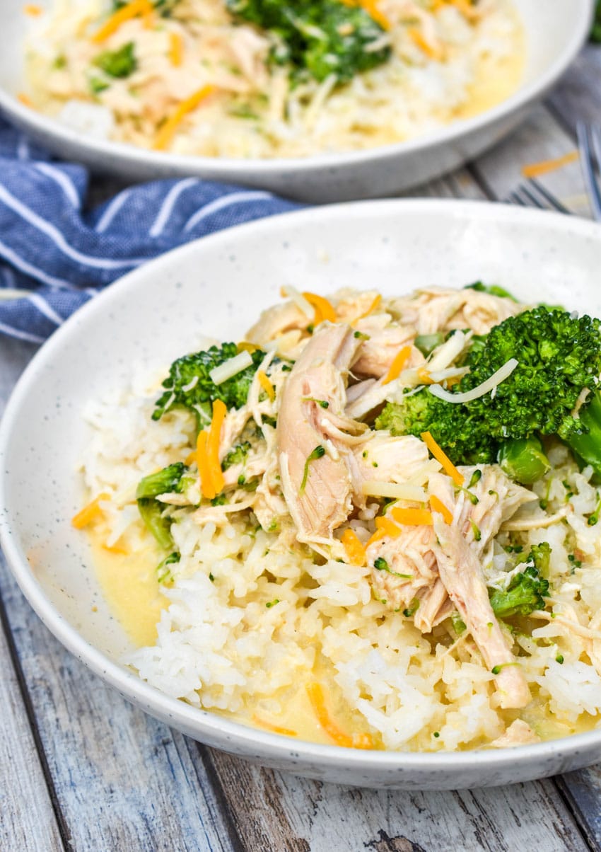 slow cooker chicken and broccoli over rice in a white bowl