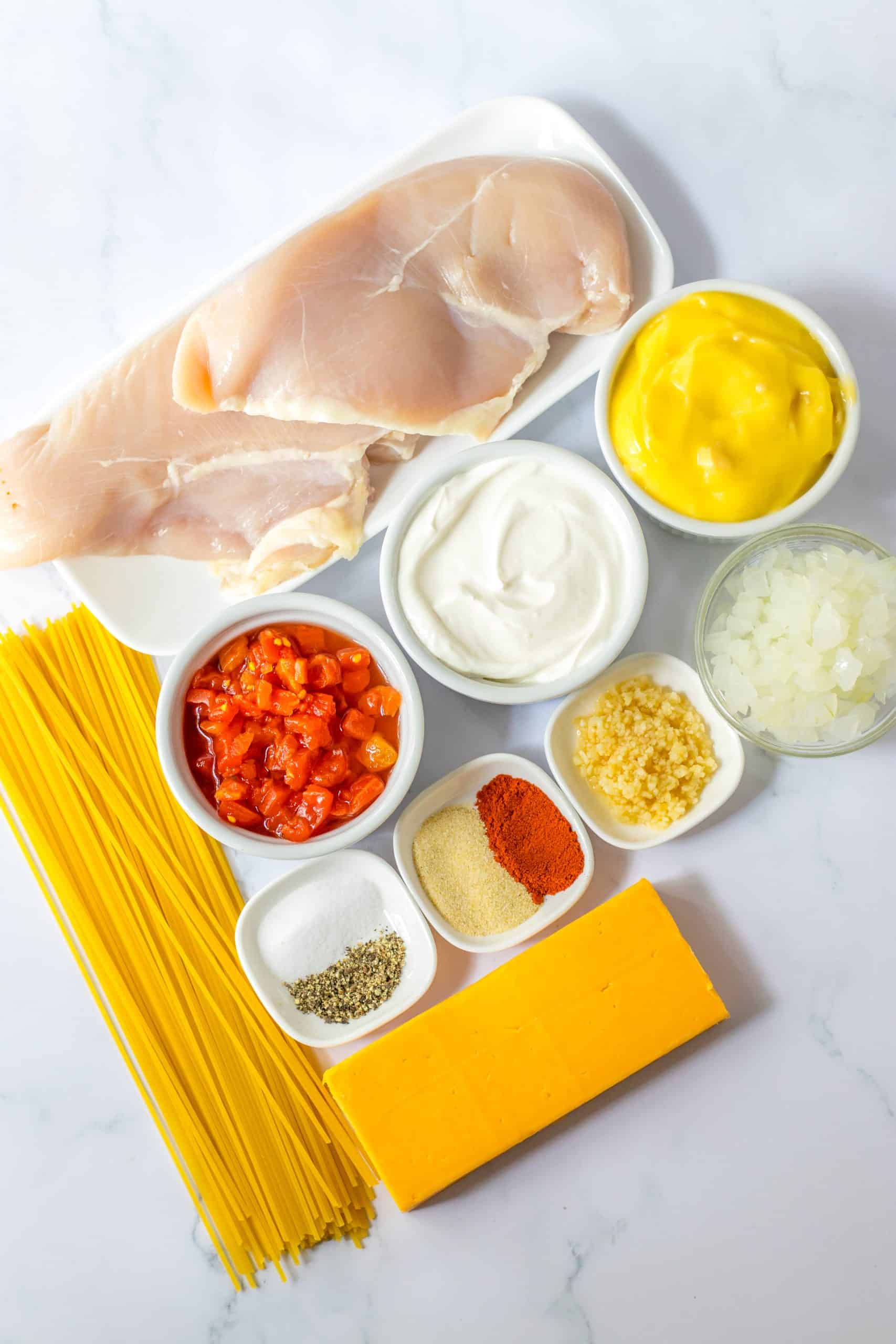 an overhead image showing the measured ingredients needed to make slow cooker chicken spaghetti