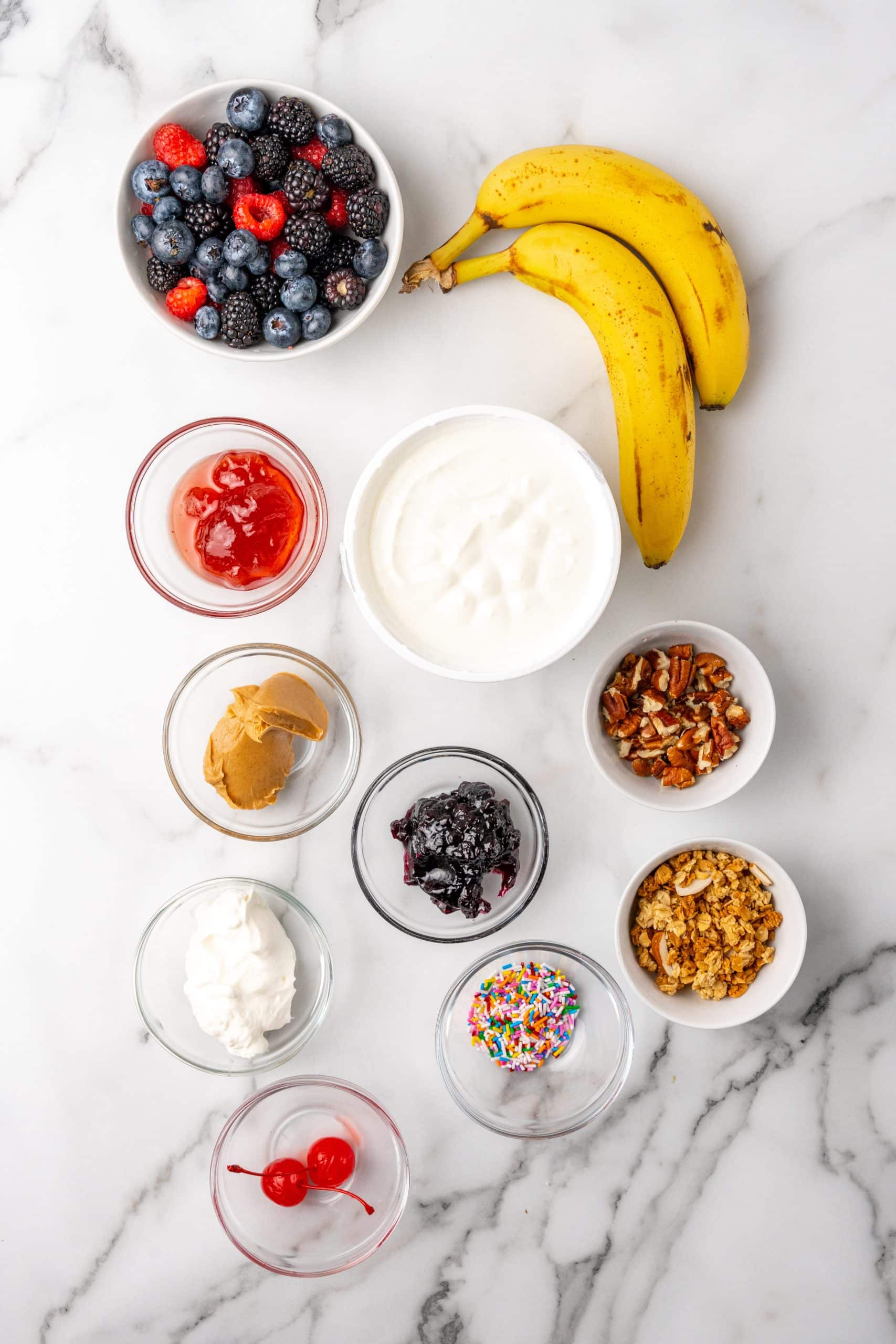 an overhead image showing the measured ingredients necessary to make breakfast banana splits