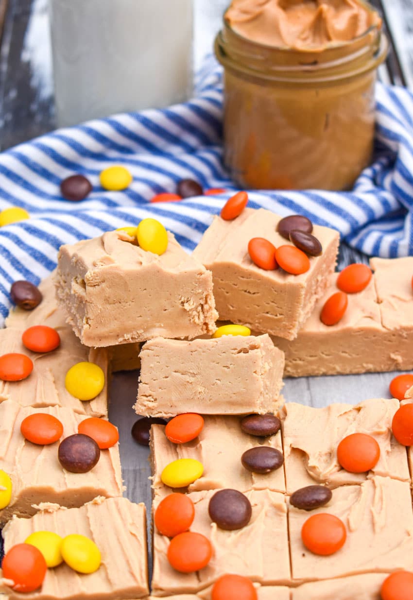 squares of two ingredient peanut butter fudge stacked on top of each other