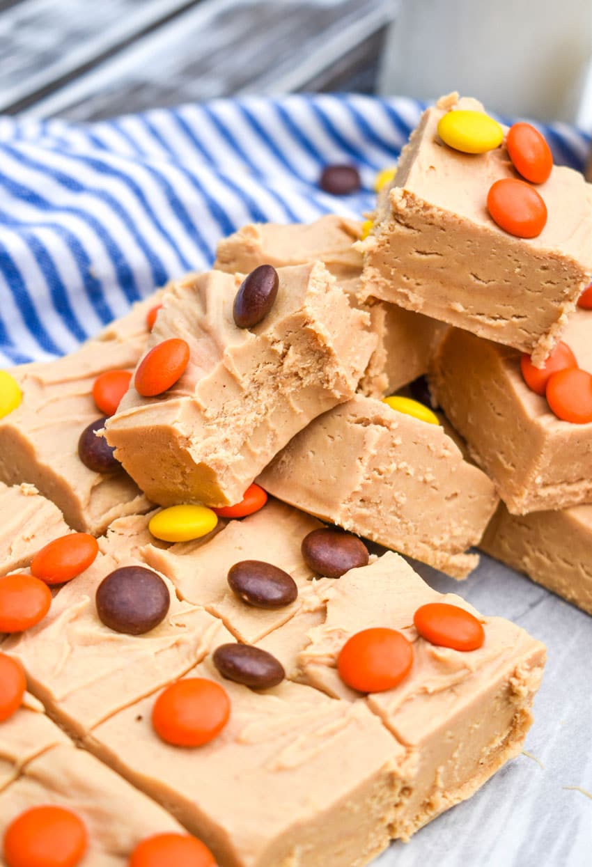 squares of Reese's peanut butter fudge stacked on top of each other