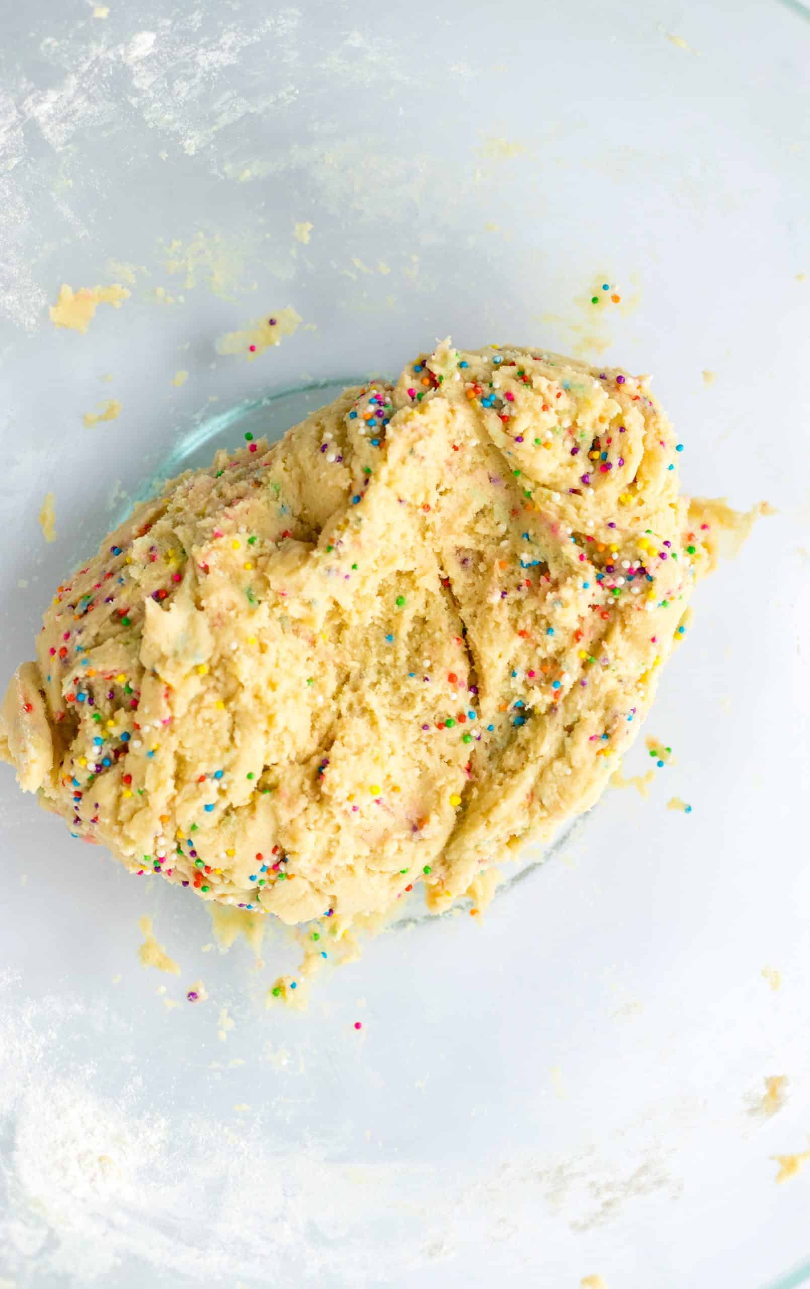 circus animal cookie dough in a glass mixing bowl