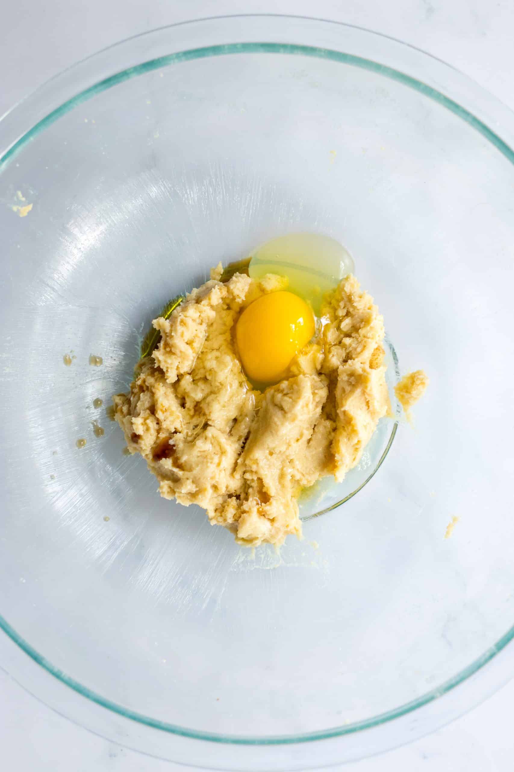 egg and creamed butter in a glass mixing bowl