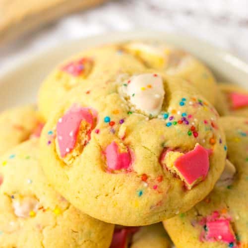 circus animal cookies piled on a white plate