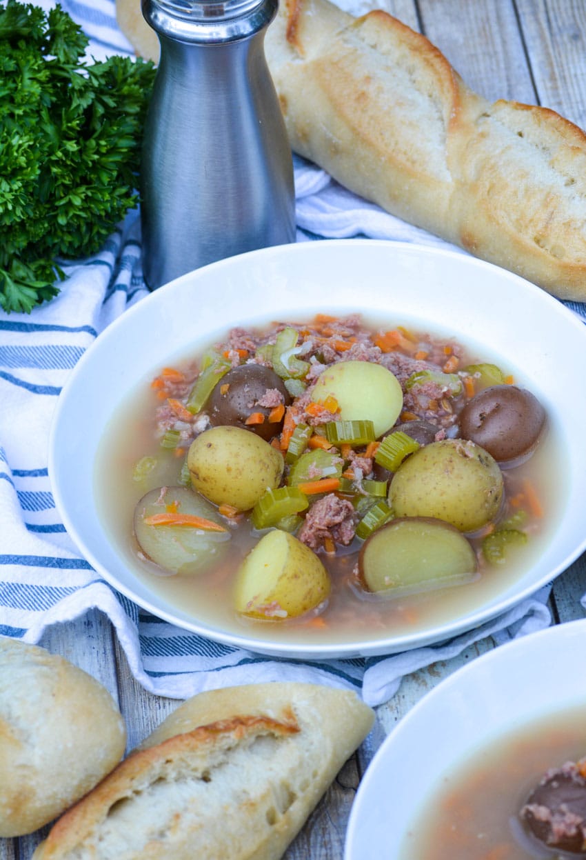 canned corned beef stew in a white bowl
