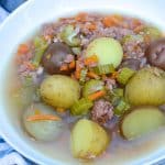 canned corned beef stew in a white bowl