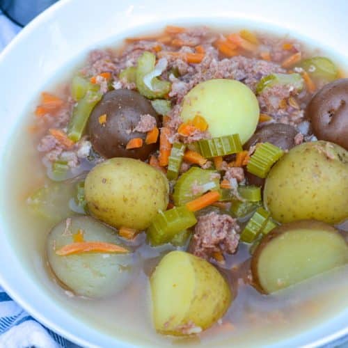 canned corned beef stew in a white bowl