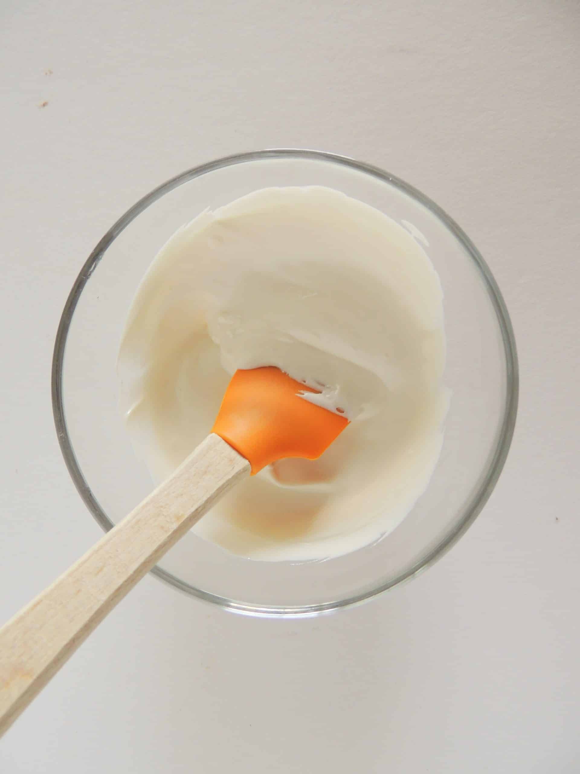 melted white chocolate in a small glass bowl
