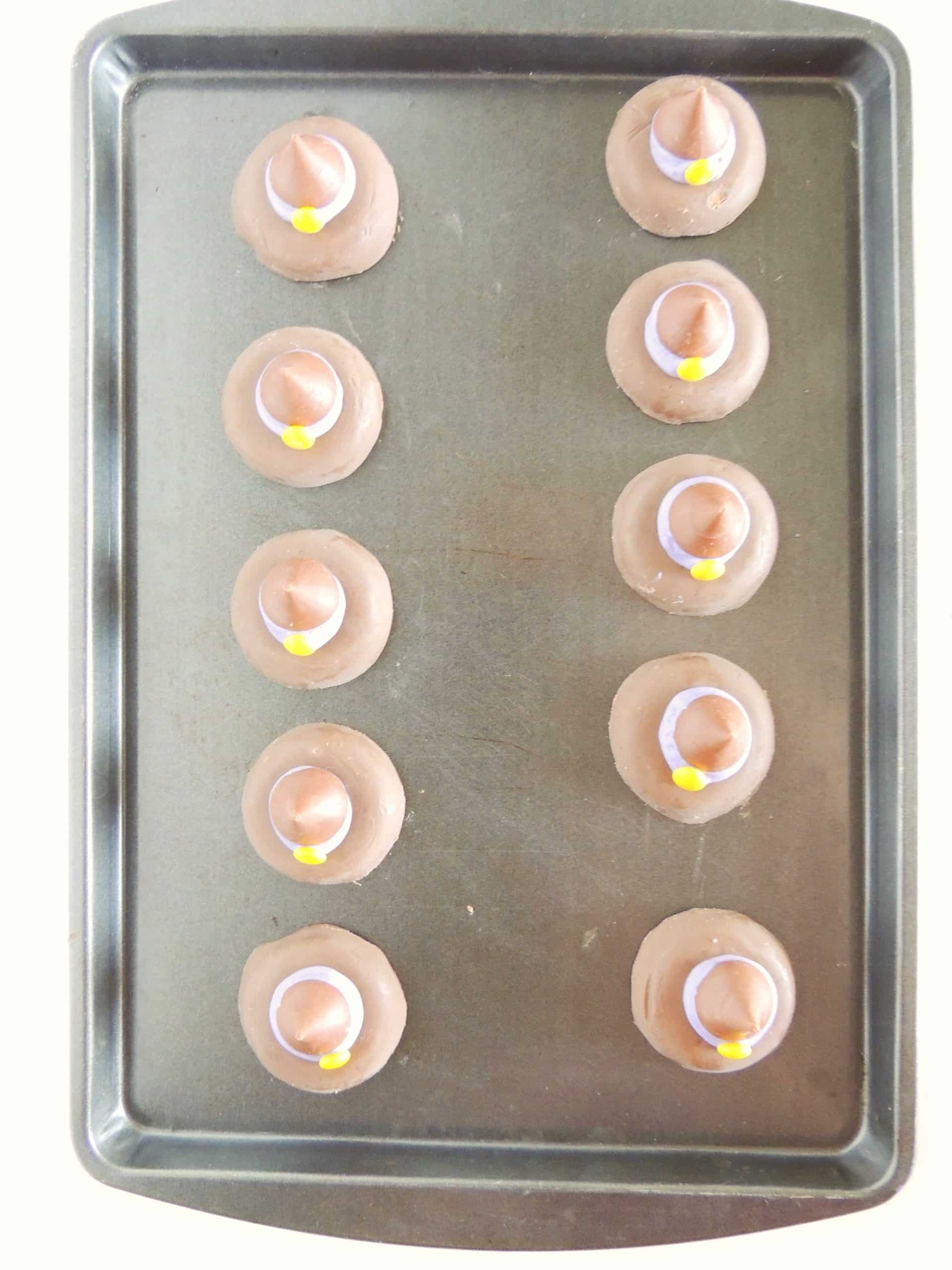 easy witch hat cookies arranged in two rows on a metal baking sheet