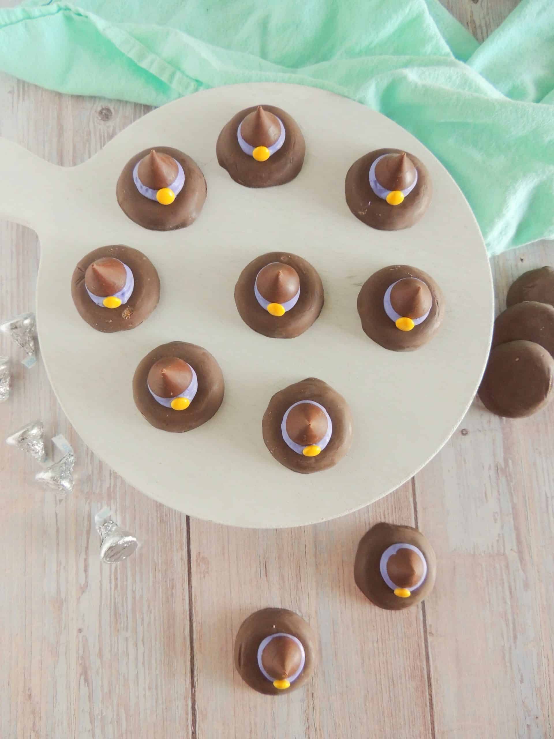 easy witch hat cookies on a white cake stand