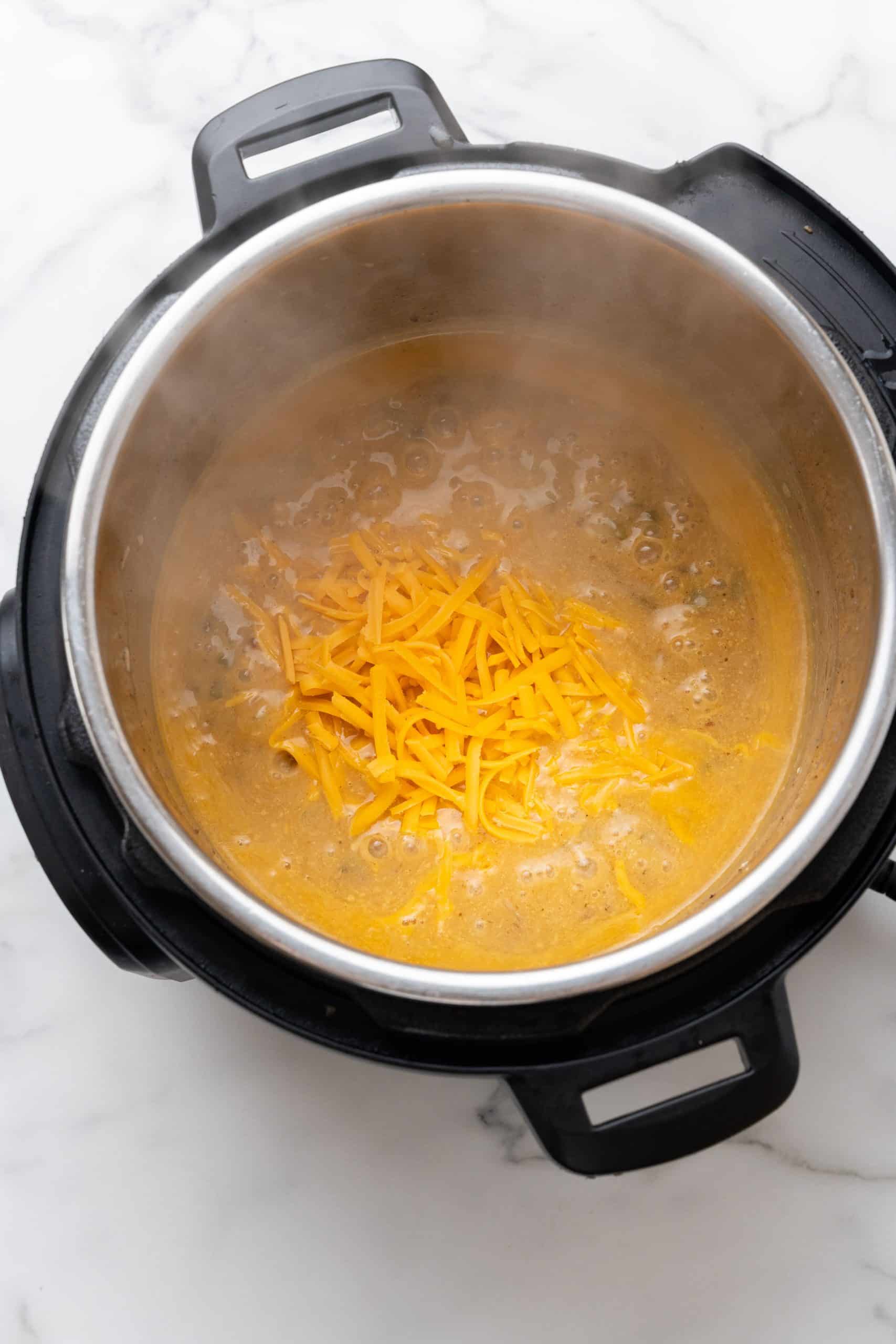 shredded cheese in the bowl of an instant pot
