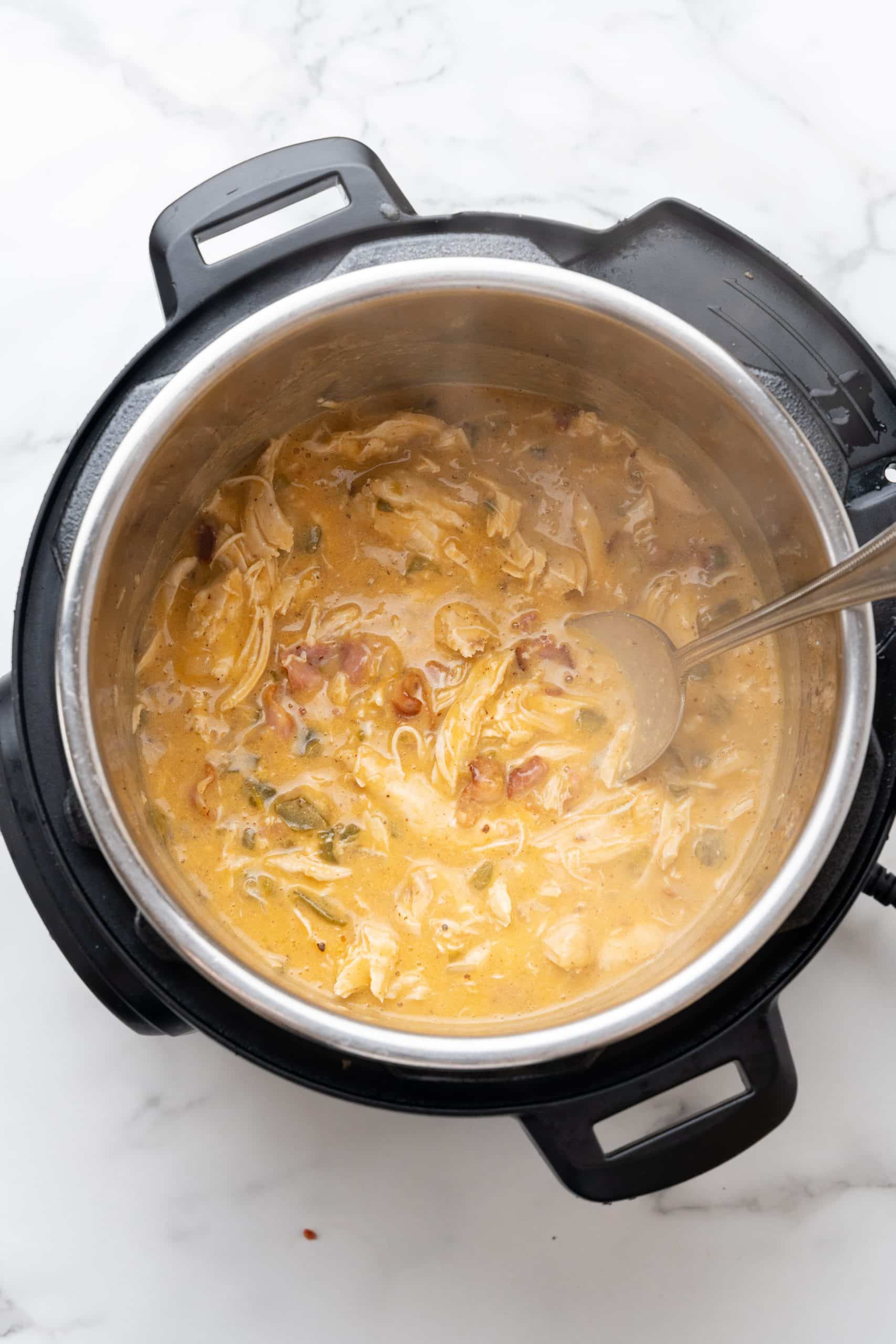 jalapeno cheddar chicken in the bowl of an instant pot pressure cooker