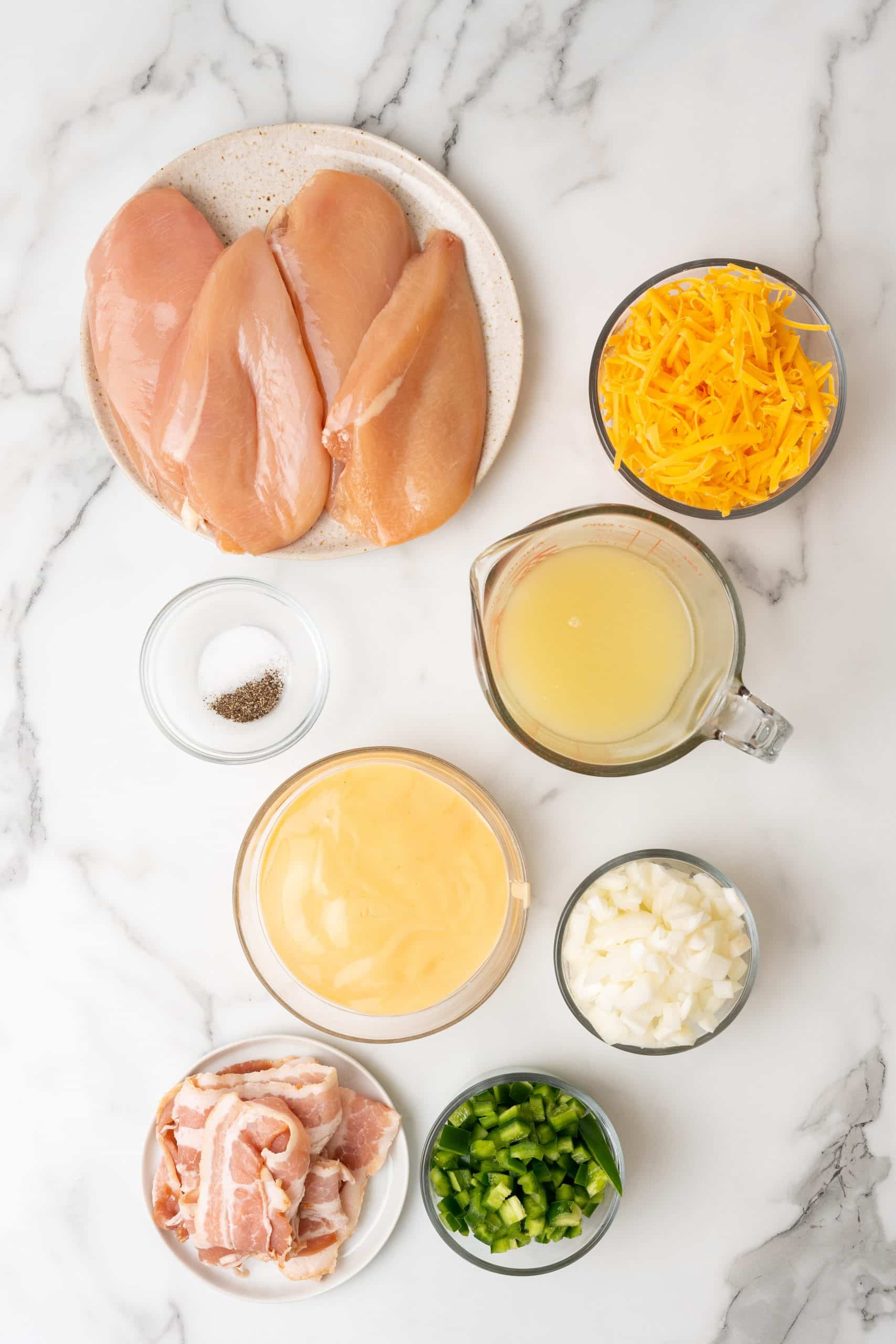 an overhead image showing the measured ingredients needed to make a batch of instant pot jalapeno cheddar chicken