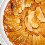 apple upside down cake on a white serving plate