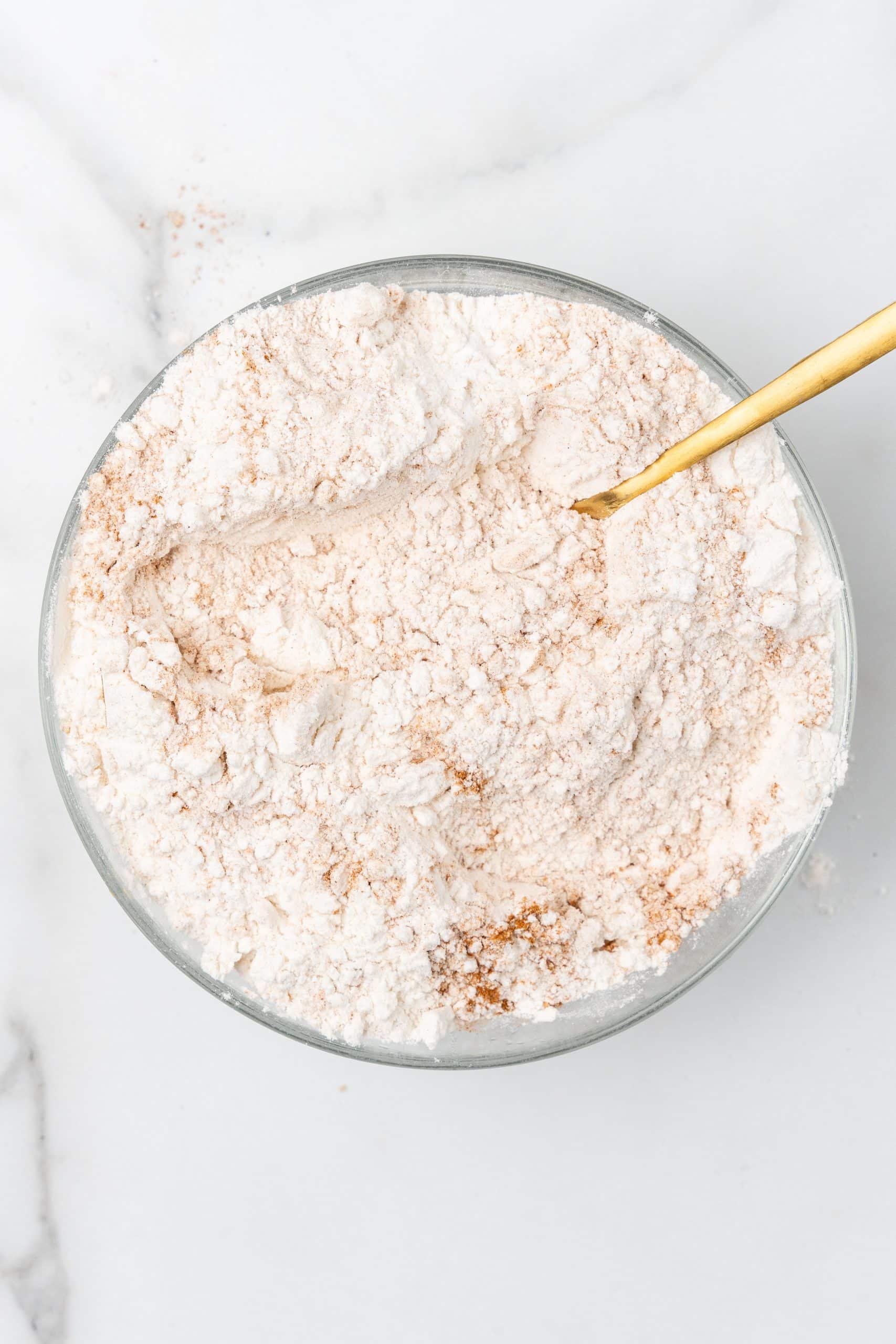 seasoned flour mixture in a glass mixing bowl