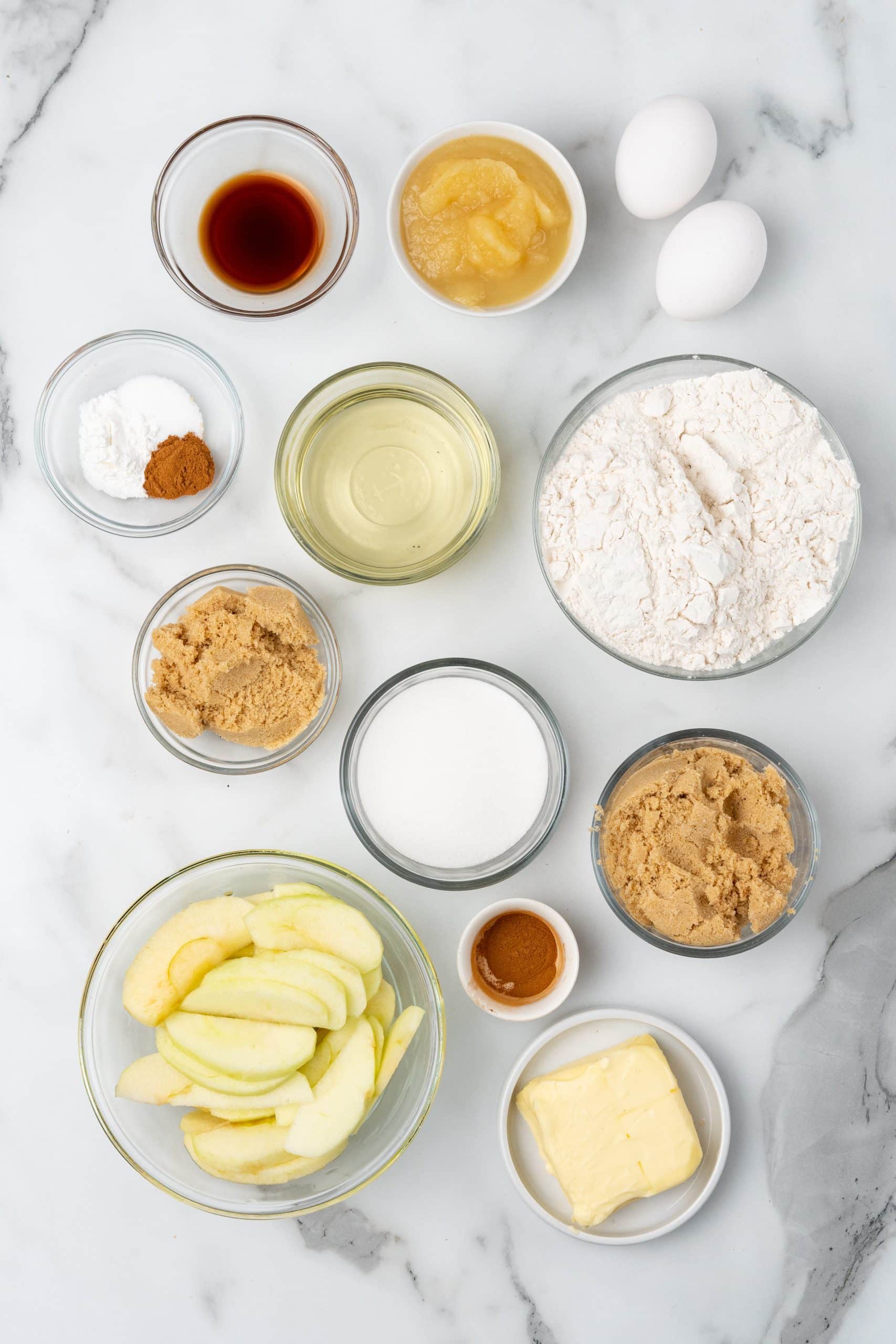 an overhead image showing the measured ingredients needed to make an apple upside down cake