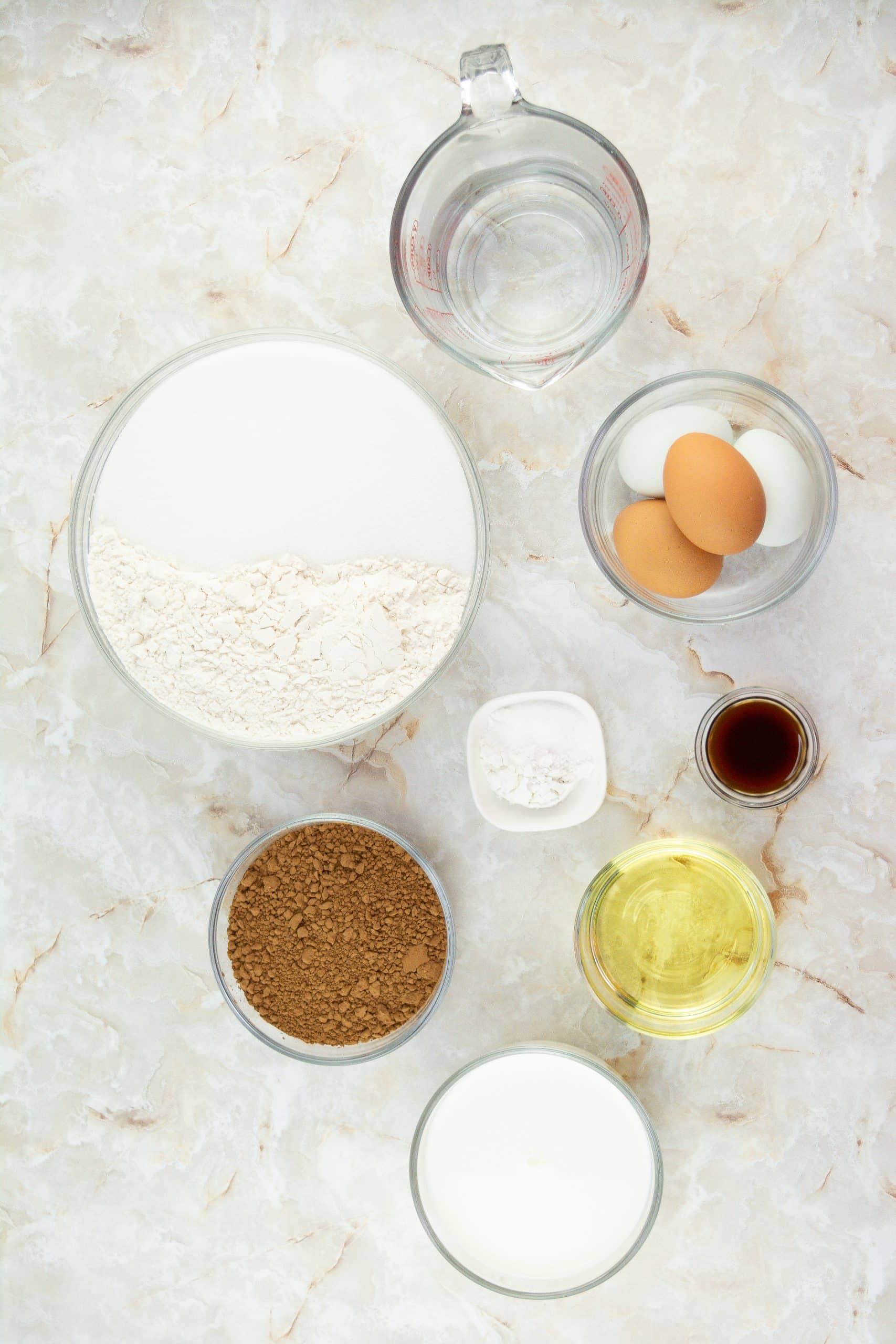 an overhead image showing the measured ingredients needed to make a batch of butterfinger cupcakes