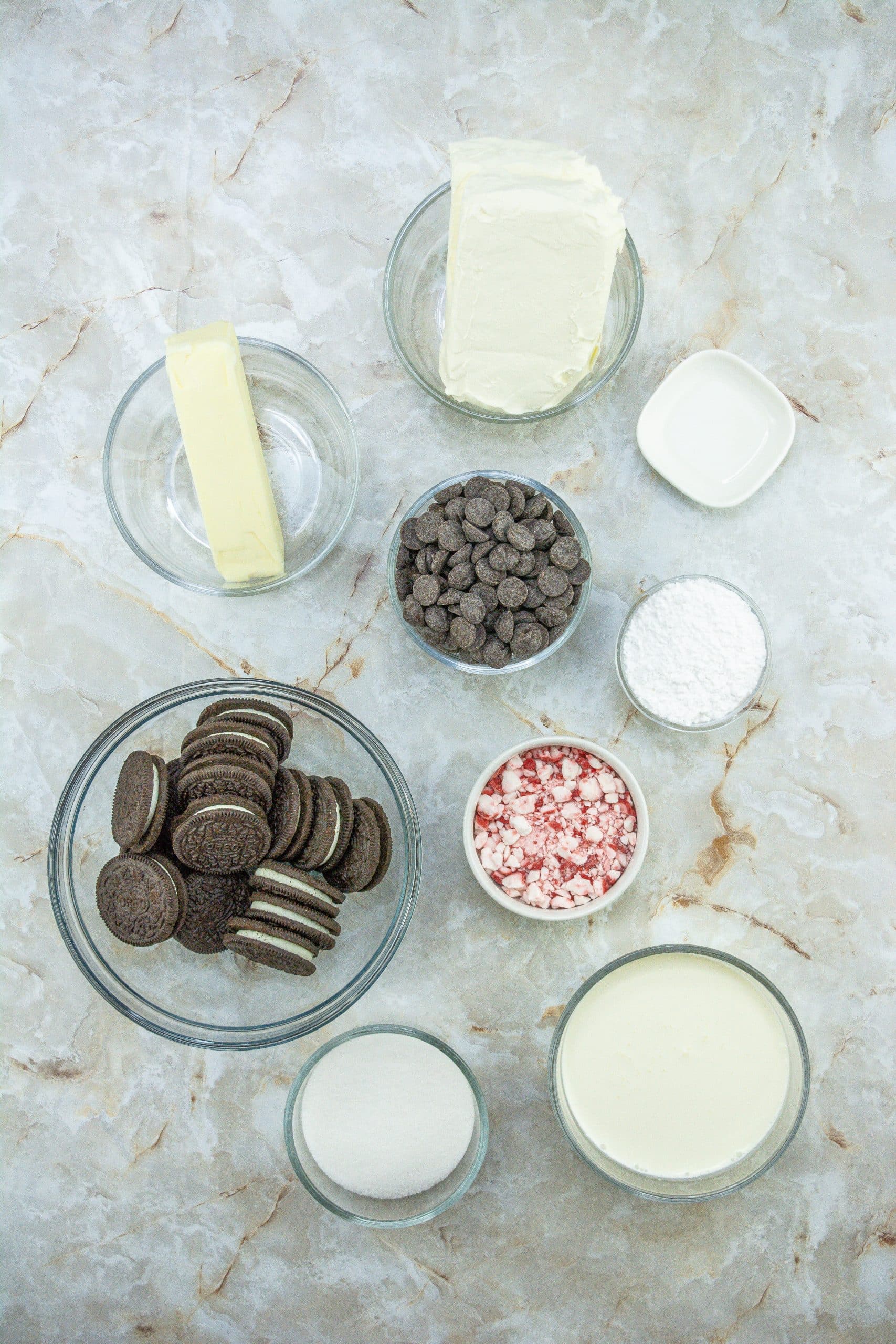 an overhead image showing the measured ingredients needed to make a batch of mini peppermint cheesecakes