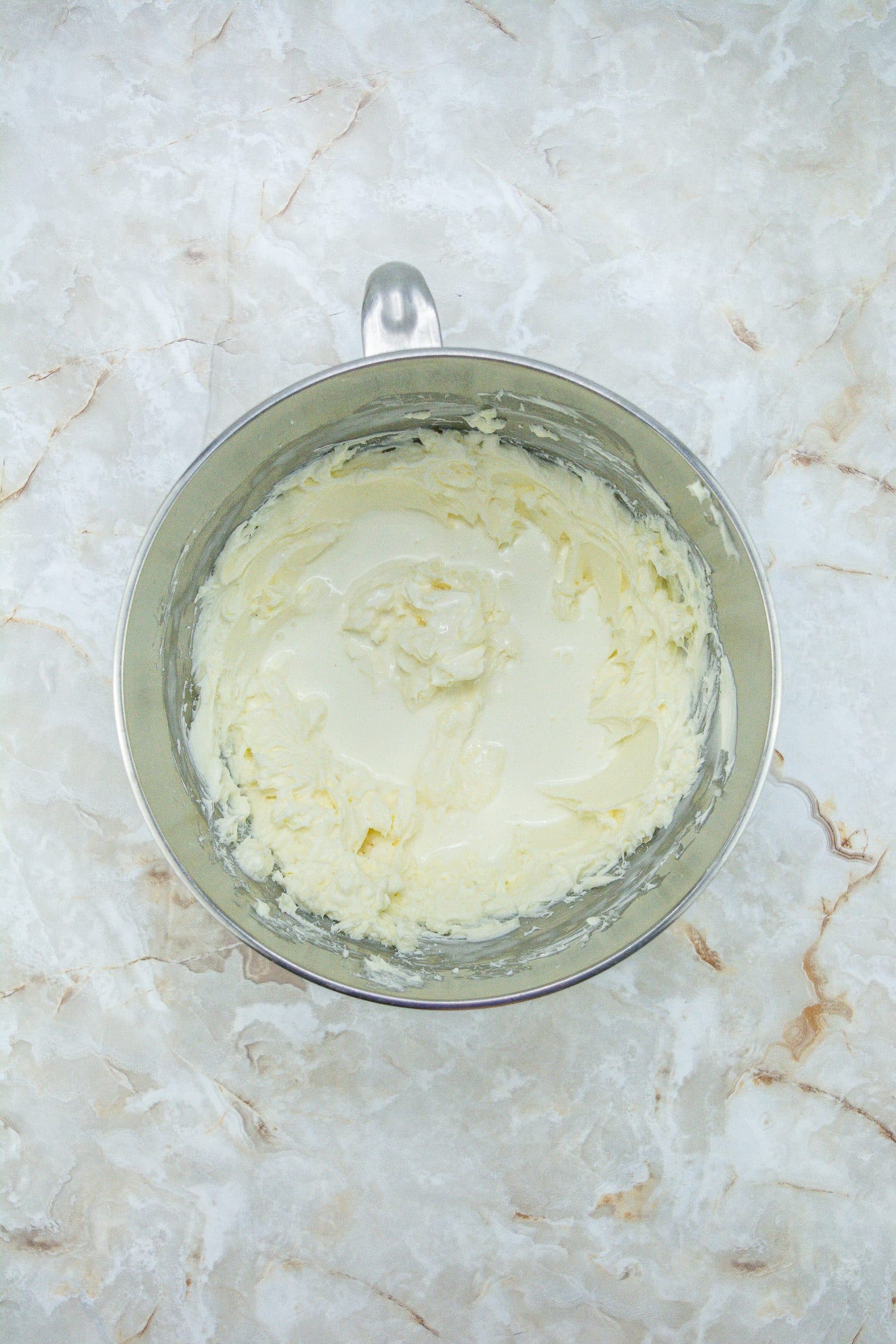 peppermint cheesecake filling in the bowl of a stand mixer