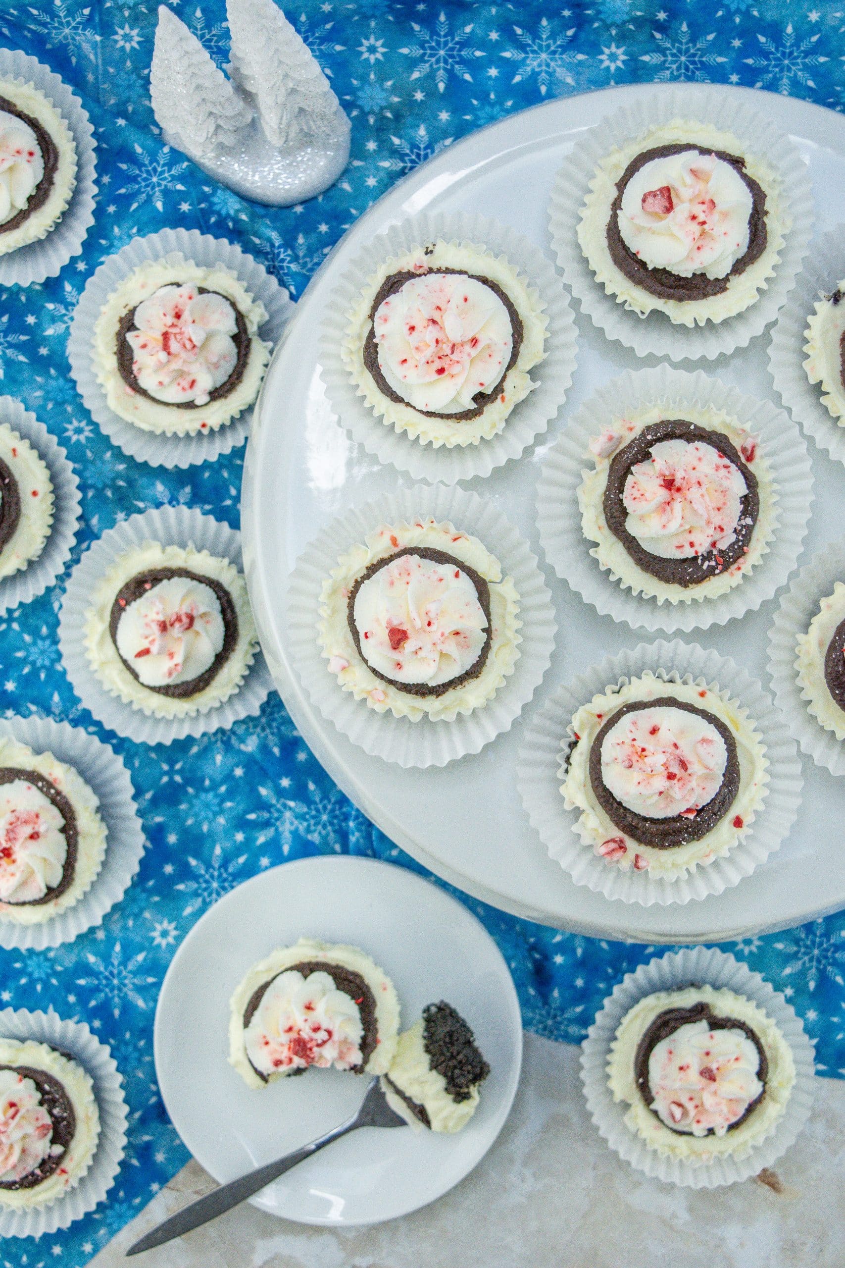 mini peppermint cheesecakes on white cake stand