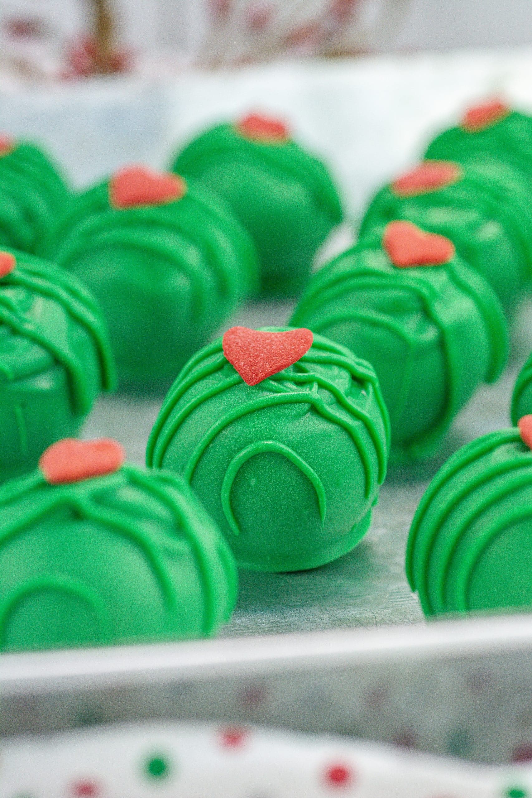 grinch truffles on a metal tray