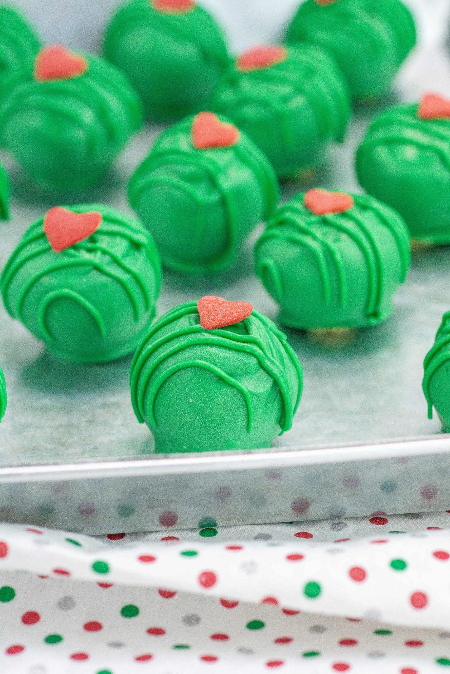 grinch truffles on a metal tray