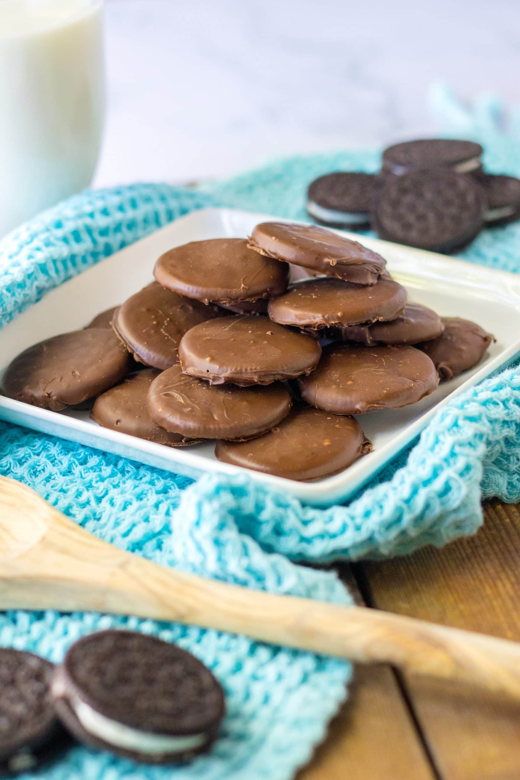 homemade thin mints stacked on a white plate