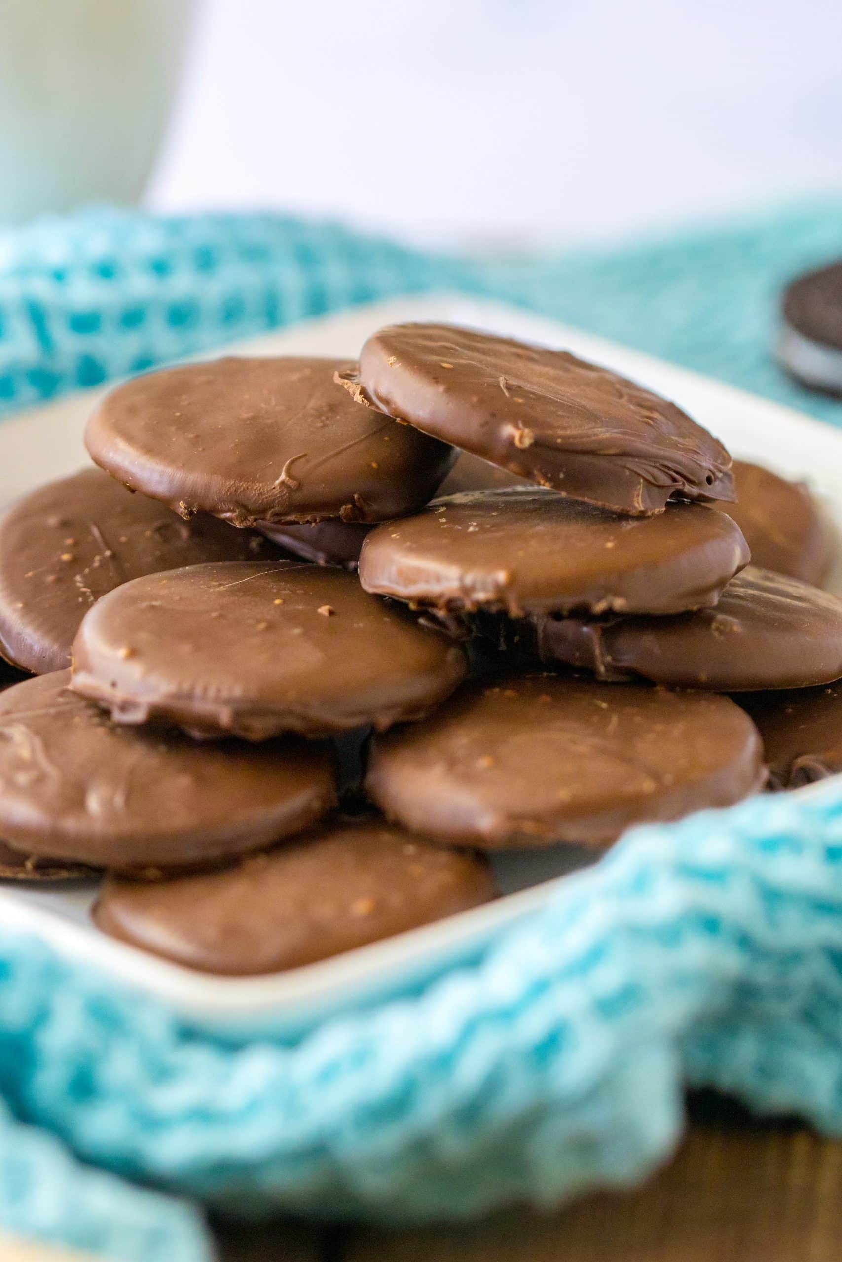 homemade thin mints stacked on a white plate