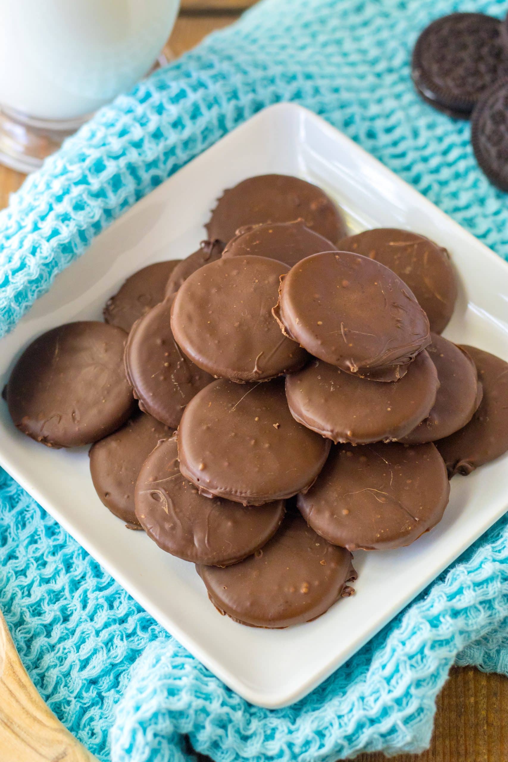 homemade thin mints stacked on a white plate