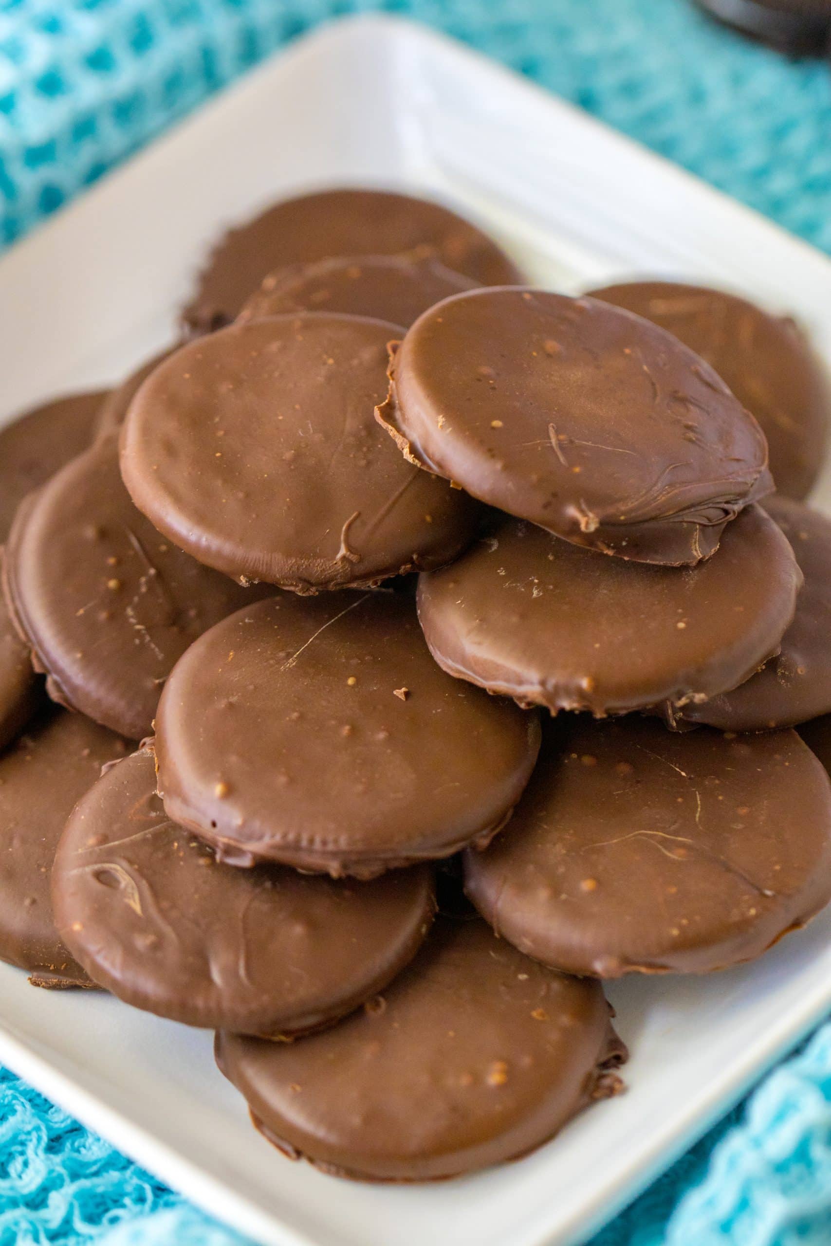 Homemade Thin Mint Cookies (Copycat Recipe) homemade thin mints stacked on a white plate