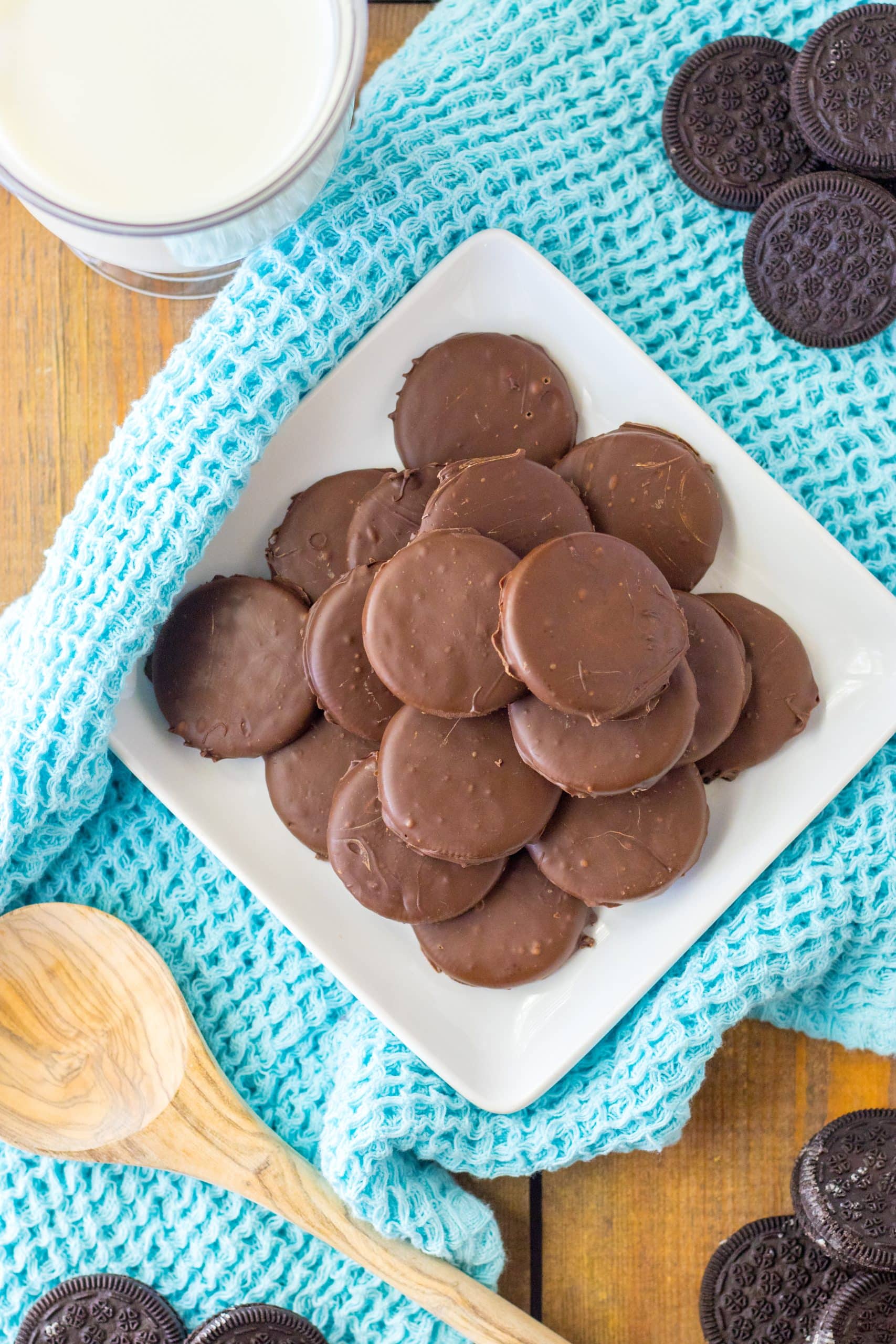 homemade thin mints stacked on a white plate