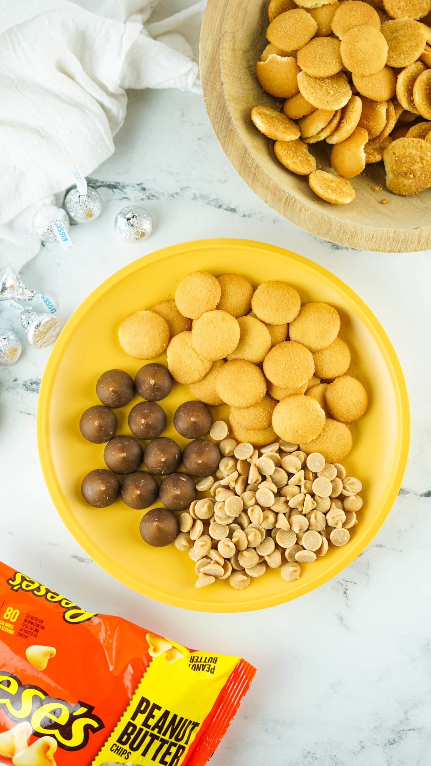 an overhead image showing the measured ingredients needed to make acorn kisses candies