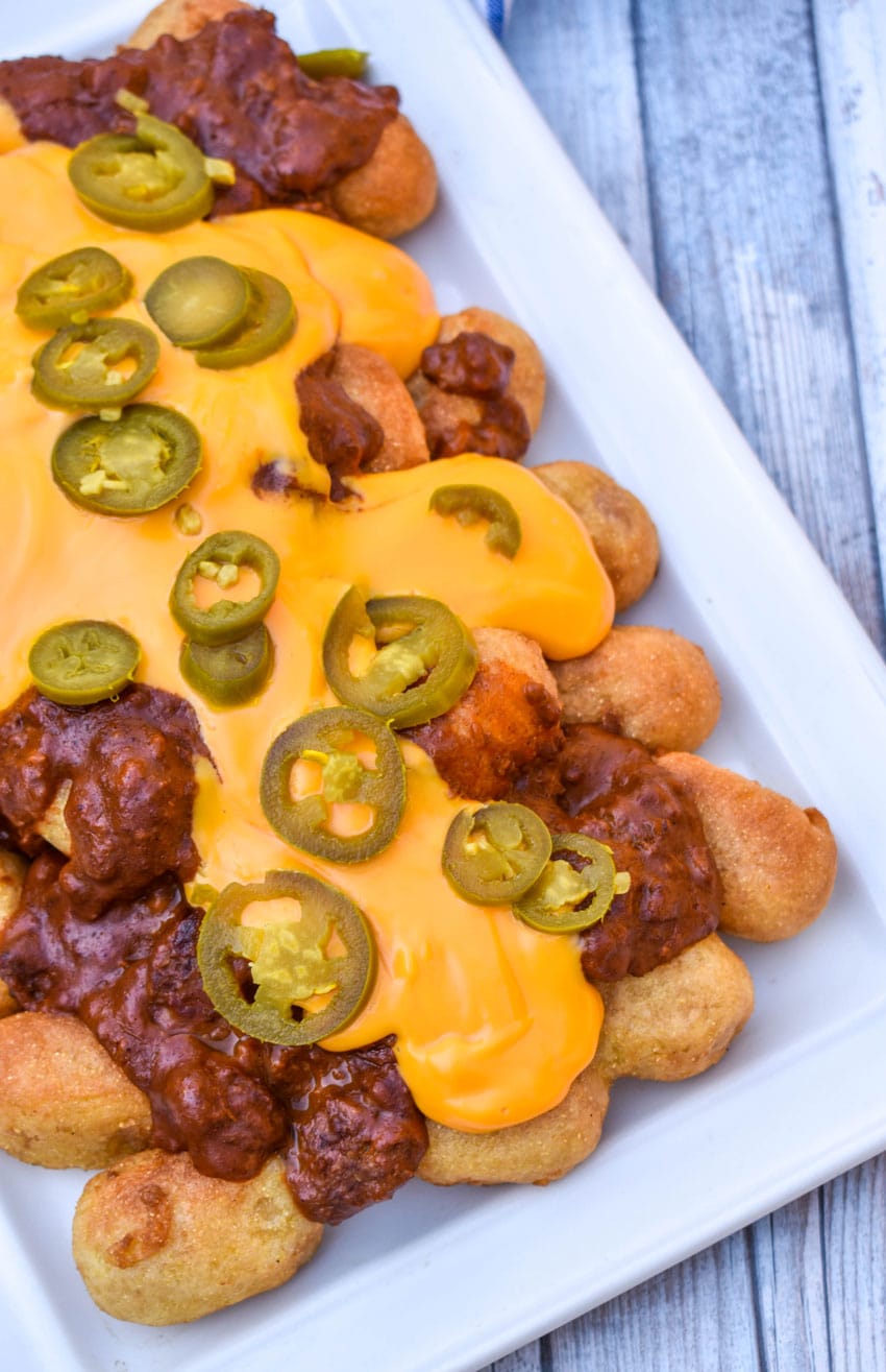 Corn Dog Nugget Nachos loaded corn dog nugget nachos on a white serving platter
