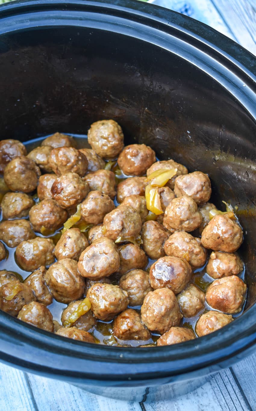 slow cooker mississippi meatballs in a black crock