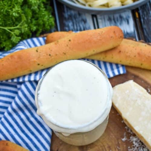 easy homemade alfredo sauce recipe in a glass mason jar