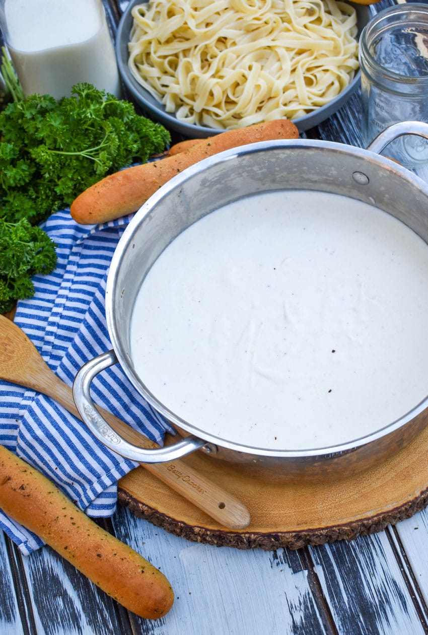 easy homemade alfredo sauce recipe in a metal sauce pan