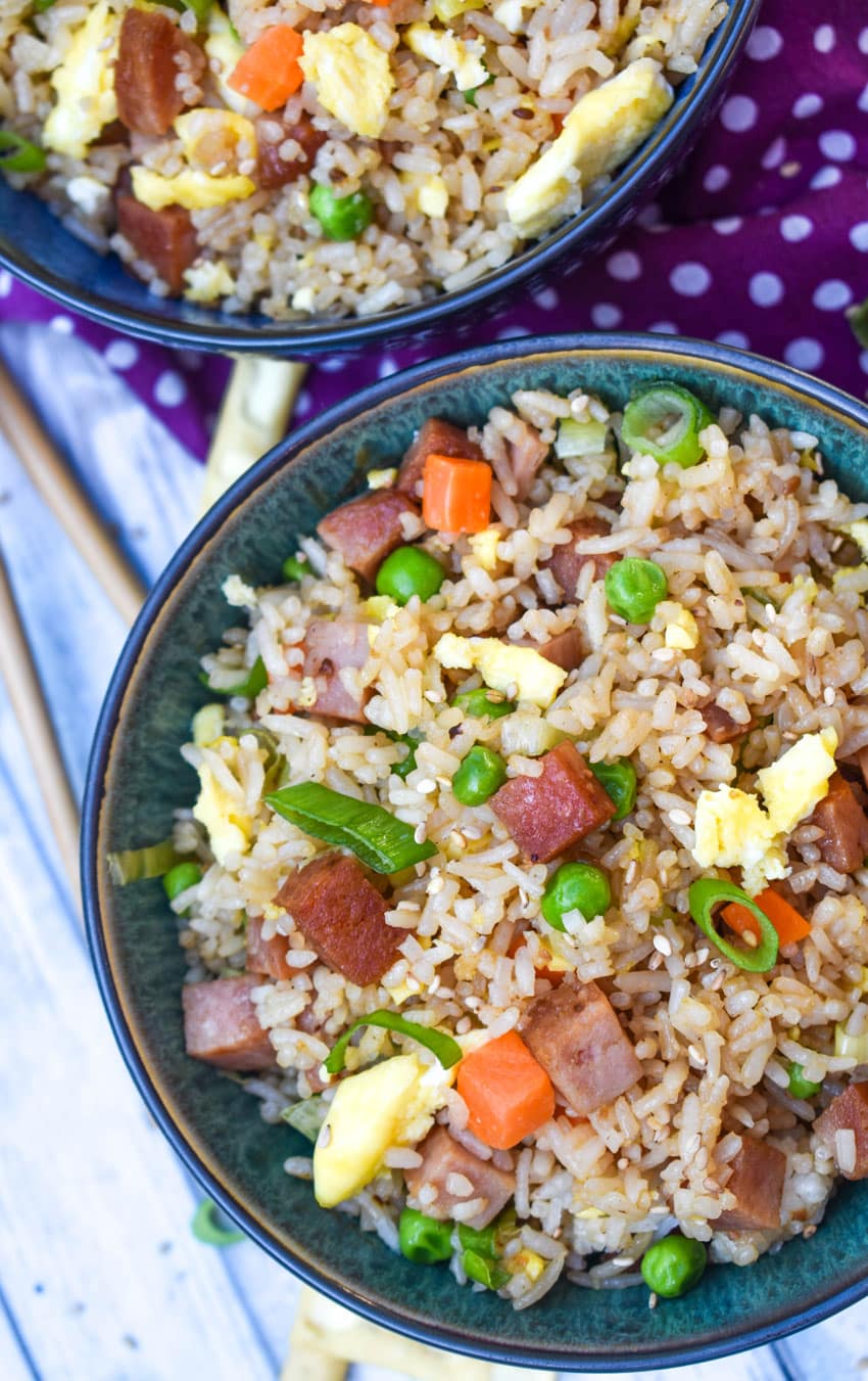 spam fried rice in two blue bowls