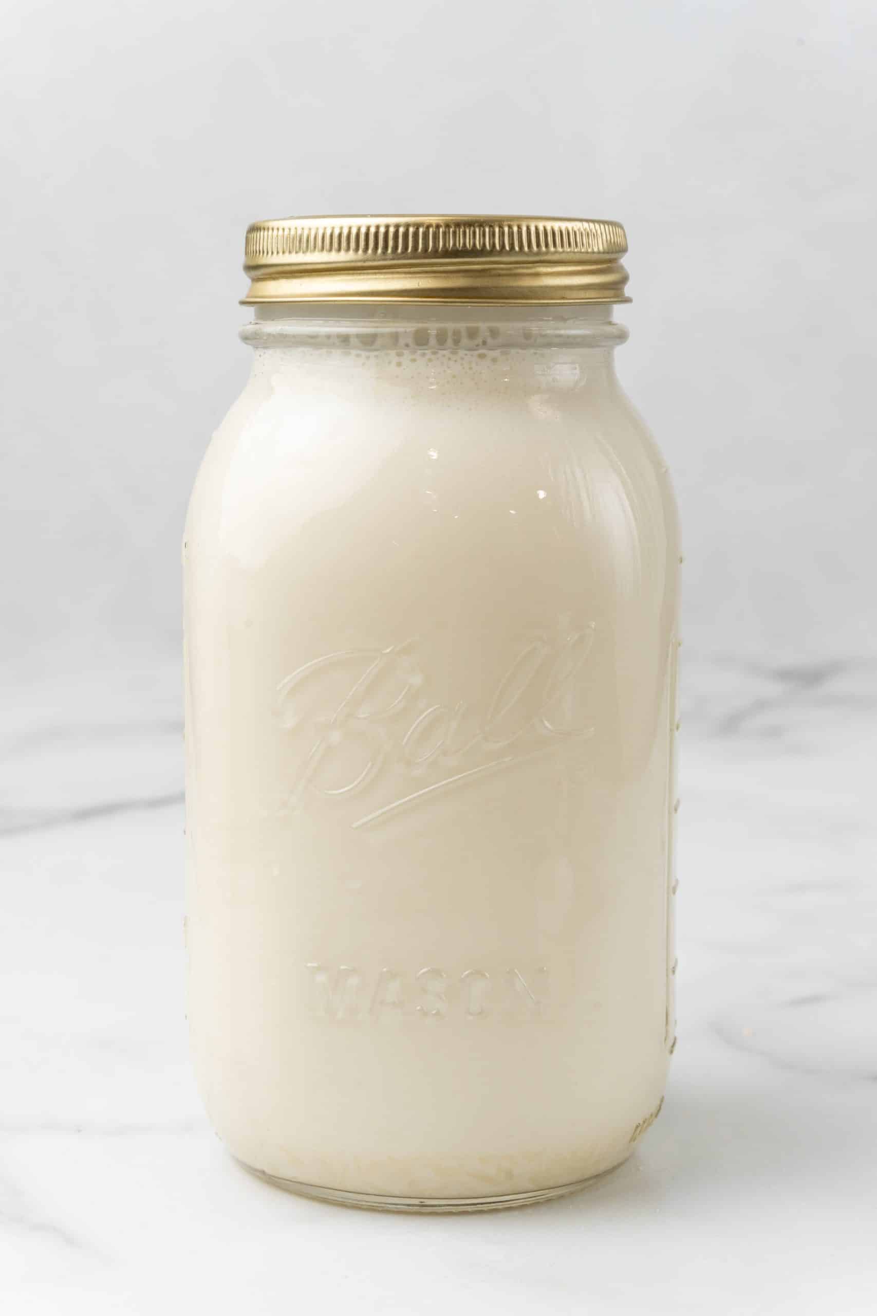 homemade hazelnut coffee creamer in a sealed glass mason jar