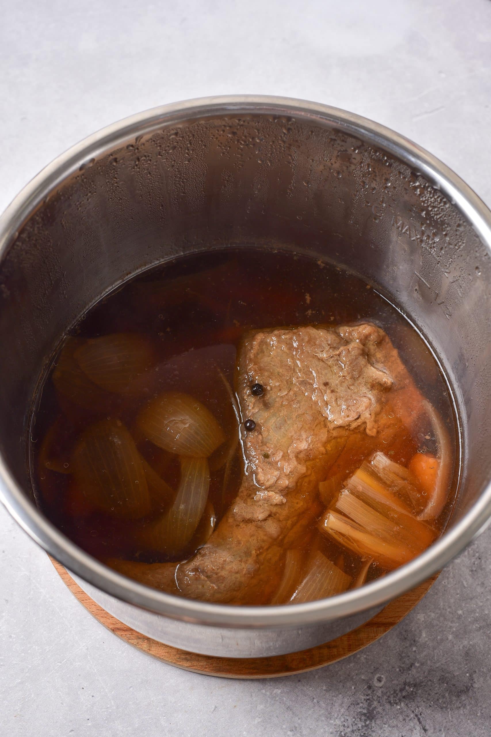 cooked corned beef in the bowl of an instant pot